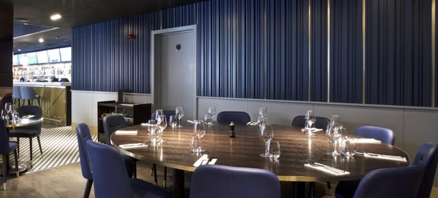 Private hire meeting space at Frankie's Sports Bar with elegant round table setup.