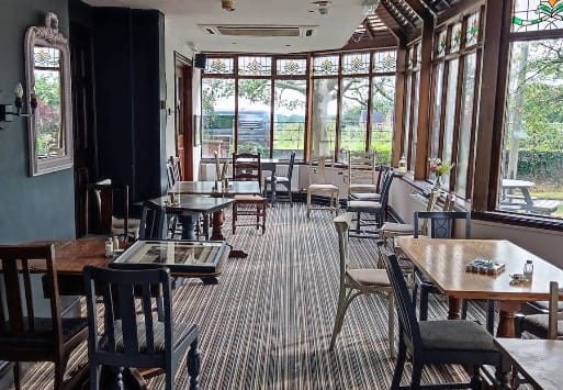 Charming venue at The Kilton Inn with natural light for intimate meetings and events.
