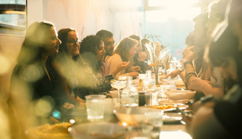 Private hire event at Hen's Teeth with attendees networking at a long table.