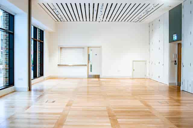 Versatile event space with natural light, ideal for workshops and presentations.