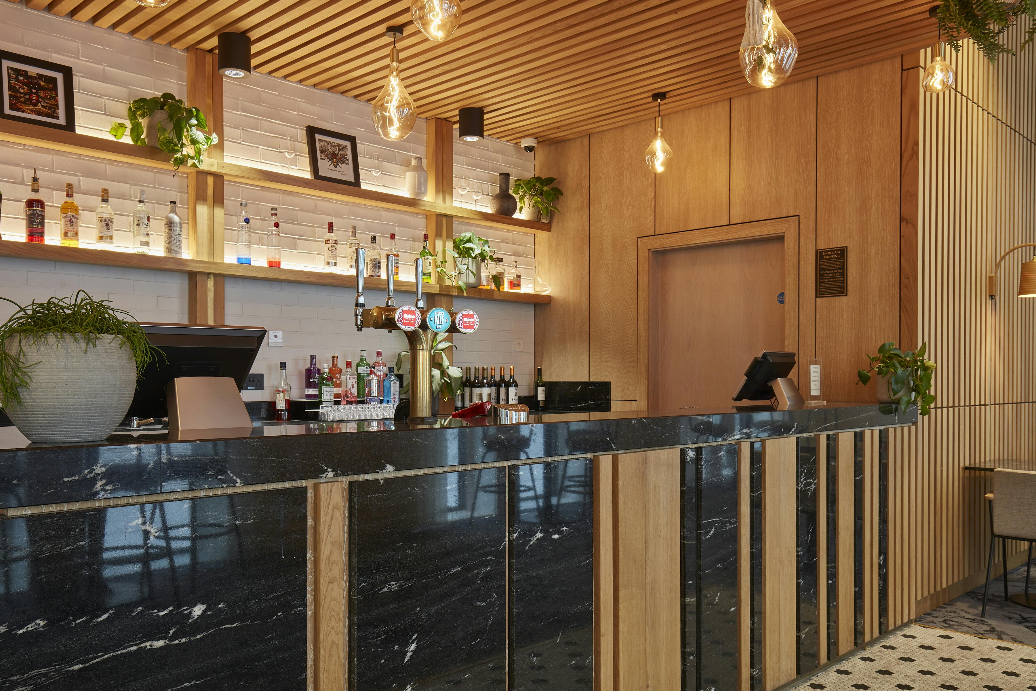 Stylish Salvation Bar with marble counter, ideal for networking events in Manchester.