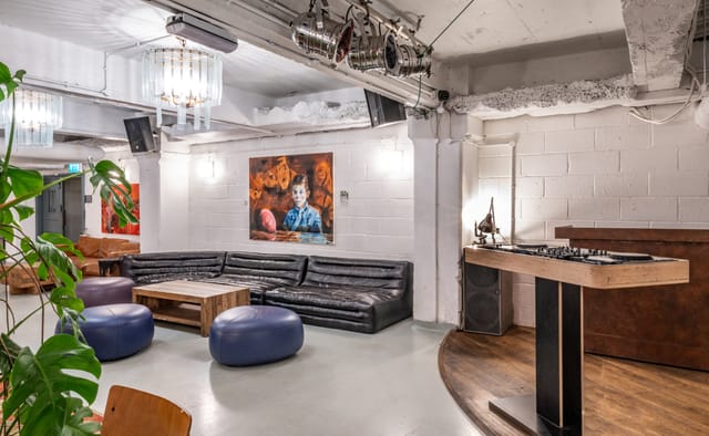 Versatile event space at Pizza East with stylish lounge, perfect for networking and celebrations.