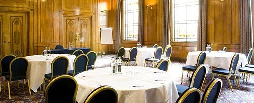 Stafford Suite meeting room with round tables, ideal for corporate events and workshops.