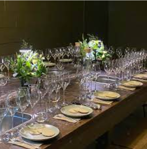 Elegant dining setup at Brityard bar with polished glassware for formal events. - Banner