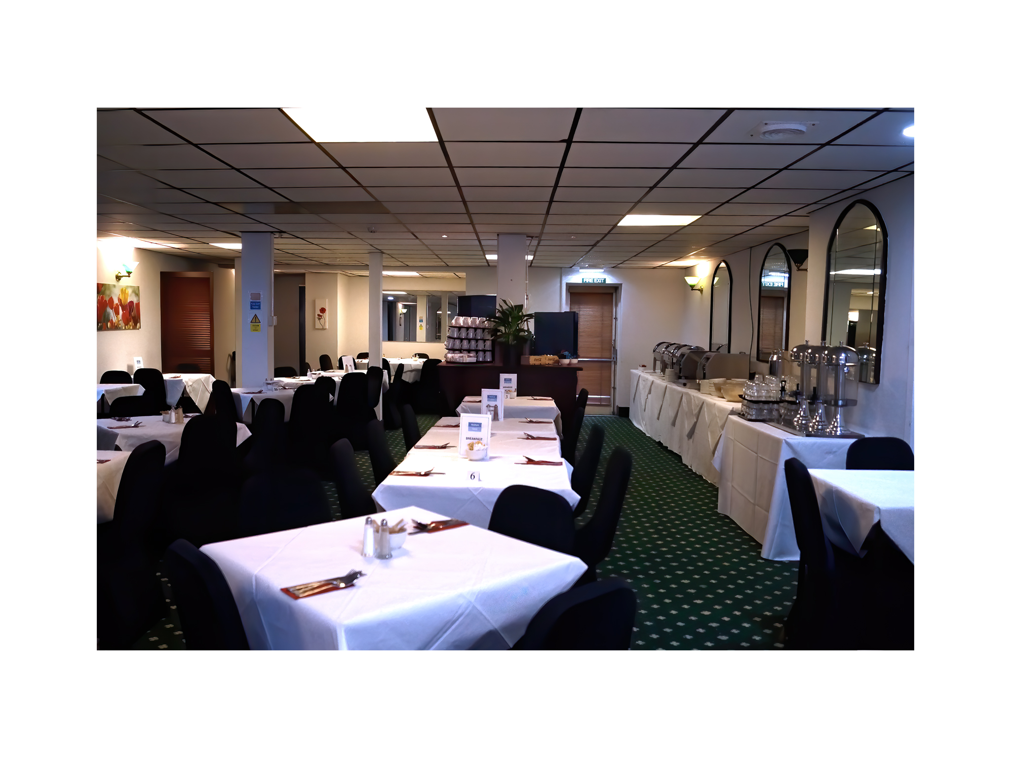 Meeting Room 1 at Bluewaters Hotel with elegant tables, ideal for events and meetings.