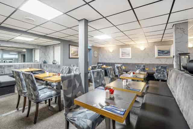 Meeting Room 1 at Bluewaters Hotel, modern seating for intimate meetings and events.