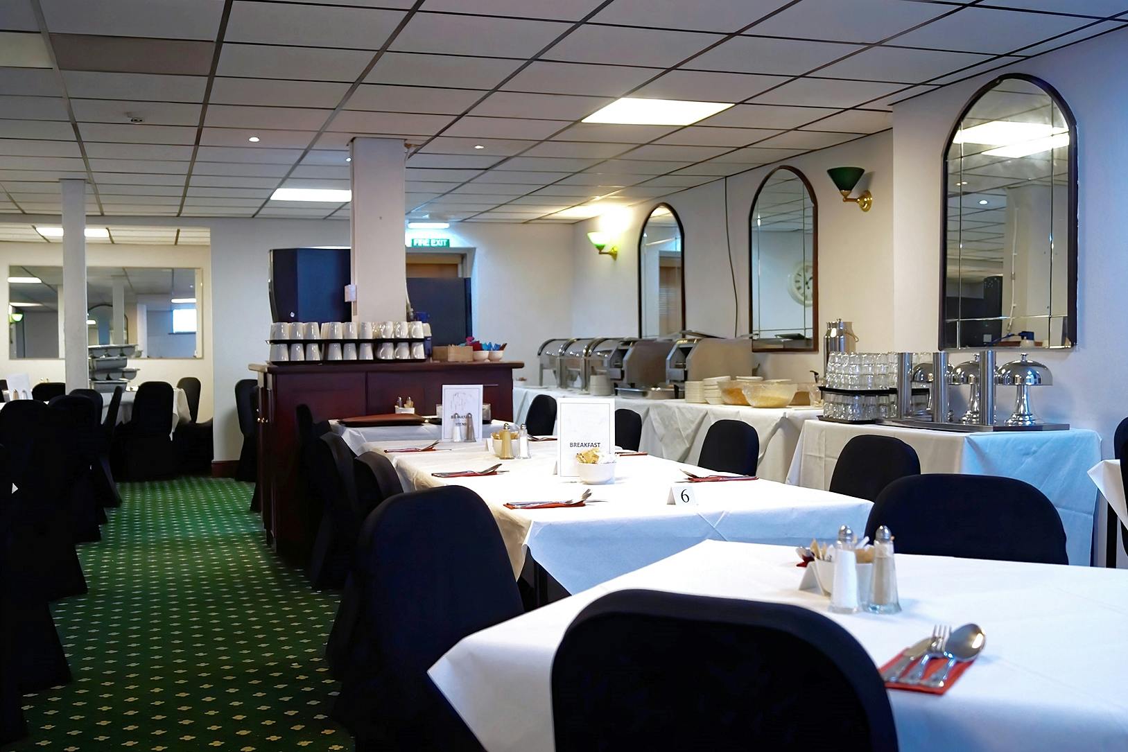 Meeting Room 1 at Bluewaters Hotel, featuring elegant dining setup for conferences and events.