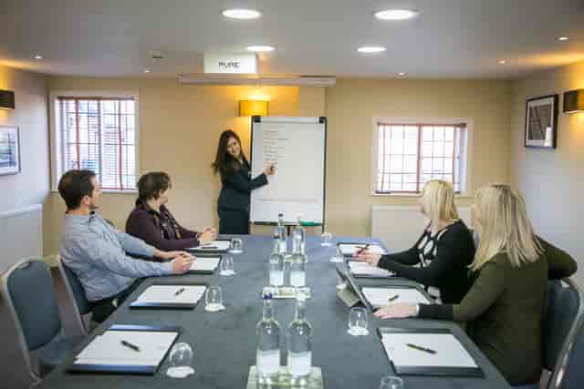 The Garden House boardroom with U-shaped tables for strategy workshops and corporate brainstorming.
