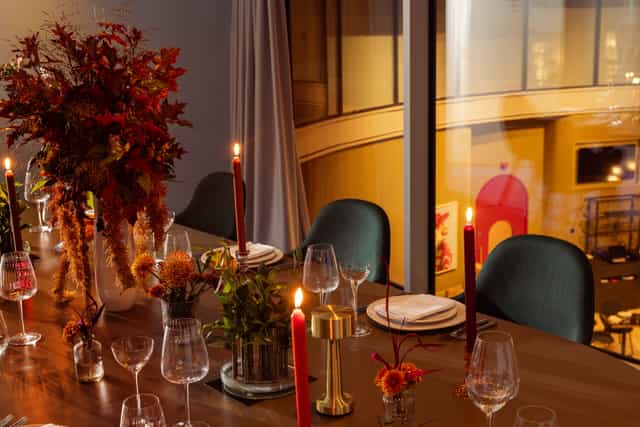 Elegant dining table in Creative Room 6, perfect for intimate events and dinner parties.