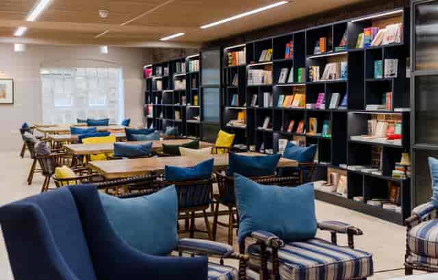 Stylish meeting space with cozy seating for workshops and networking events.