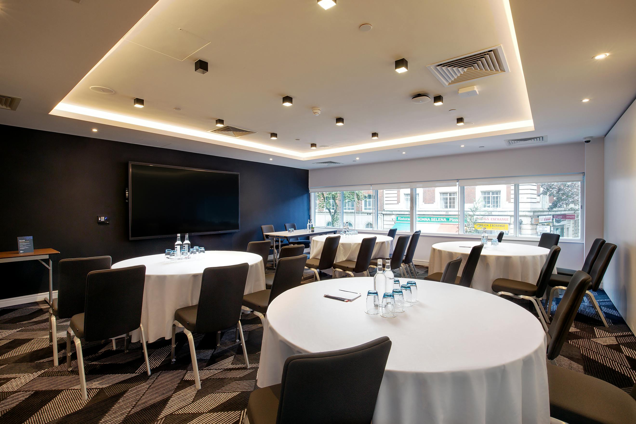 Modern meeting room at Royal National Hotel, perfect for workshops and conferences.