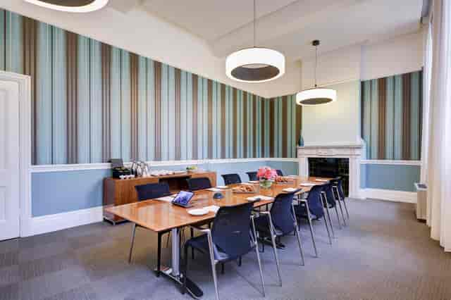 Modern meeting room in Surveyors House, featuring a striped wall for professional gatherings.