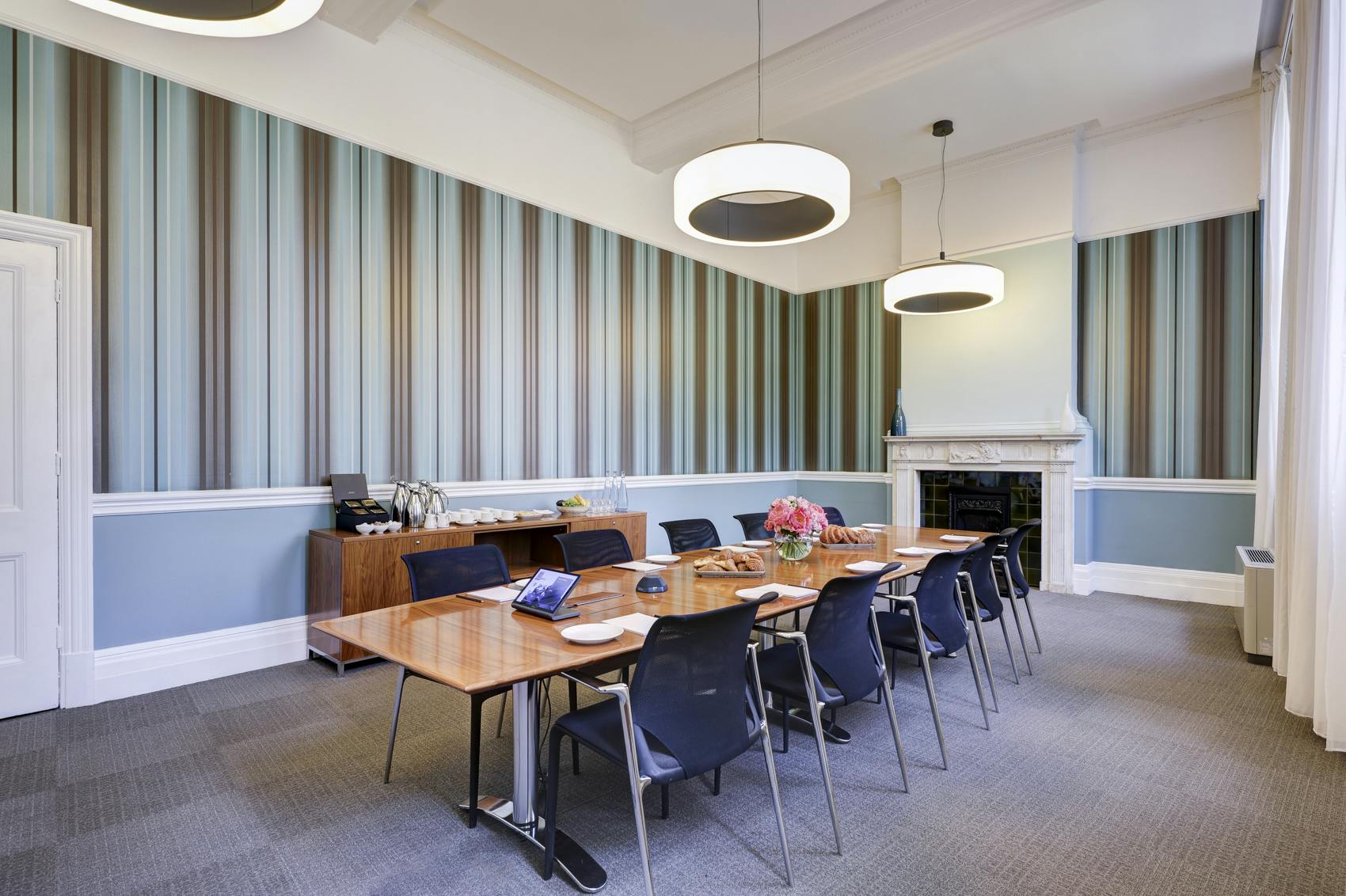 Modern meeting room in Surveyors House, featuring a striped wall for professional gatherings.