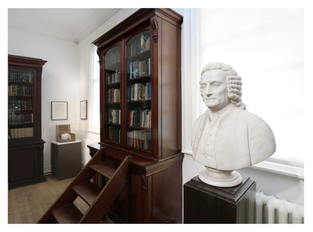David Wynter Room: elegant meeting space with wooden bookcase, ideal for lectures and workshops.