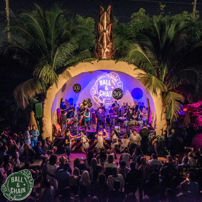 Vibrant outdoor bar at Ball & Chain with live band, perfect for events and celebrations.