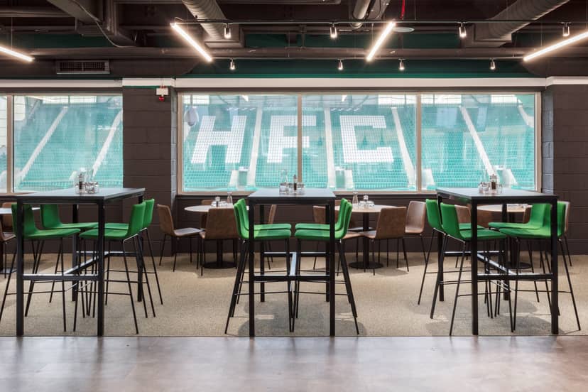 Edinburgh Club event space with green chairs, ideal for corporate gatherings and receptions.