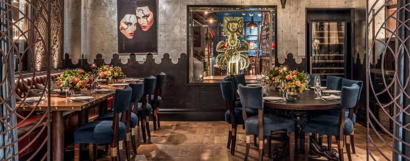Andean Room at COYA Mayfair: elegant dining space with plush blue chairs for events.
