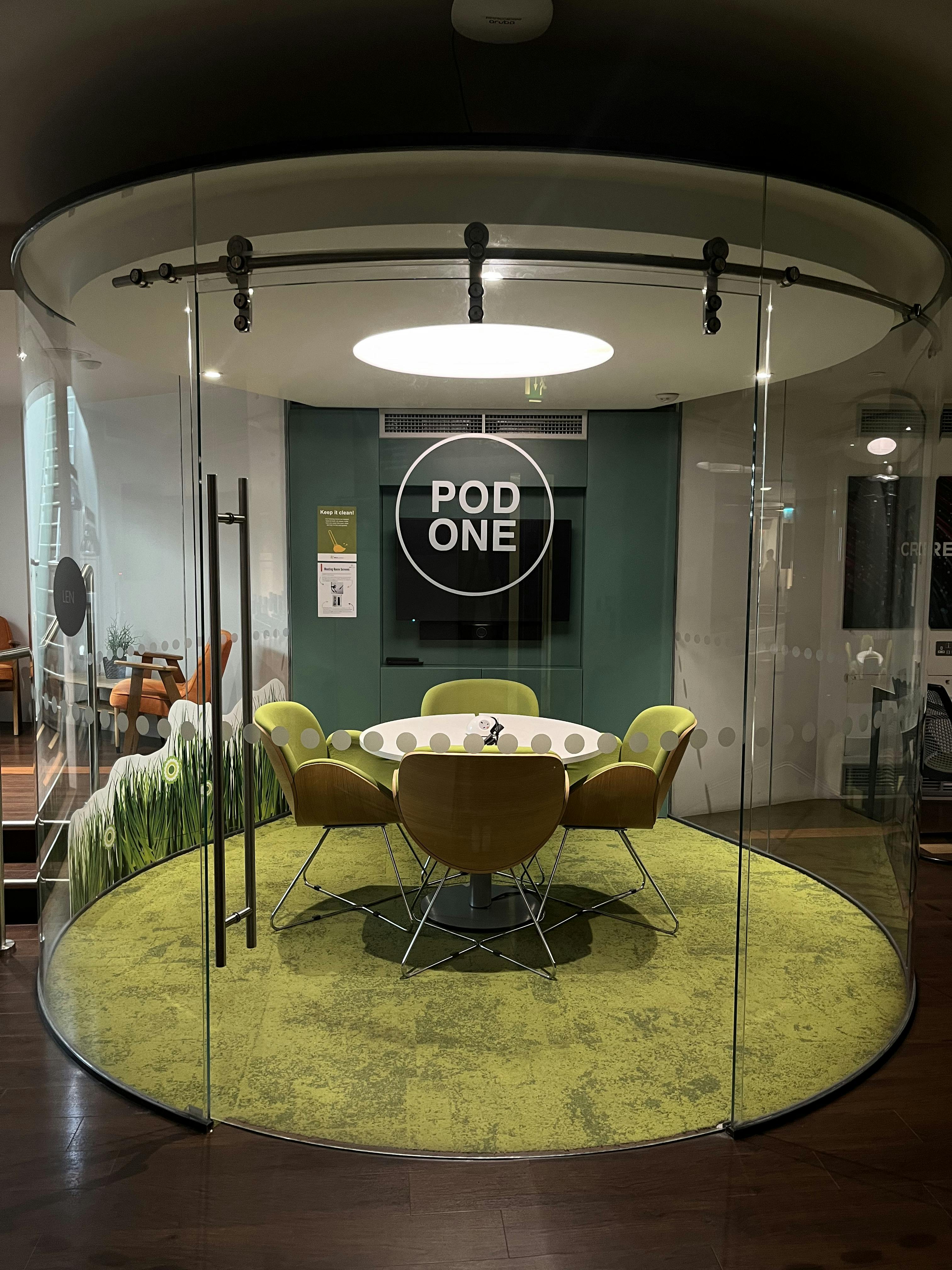 Modern meeting pod with glass walls for collaborative brainstorming sessions at IDEALondon.