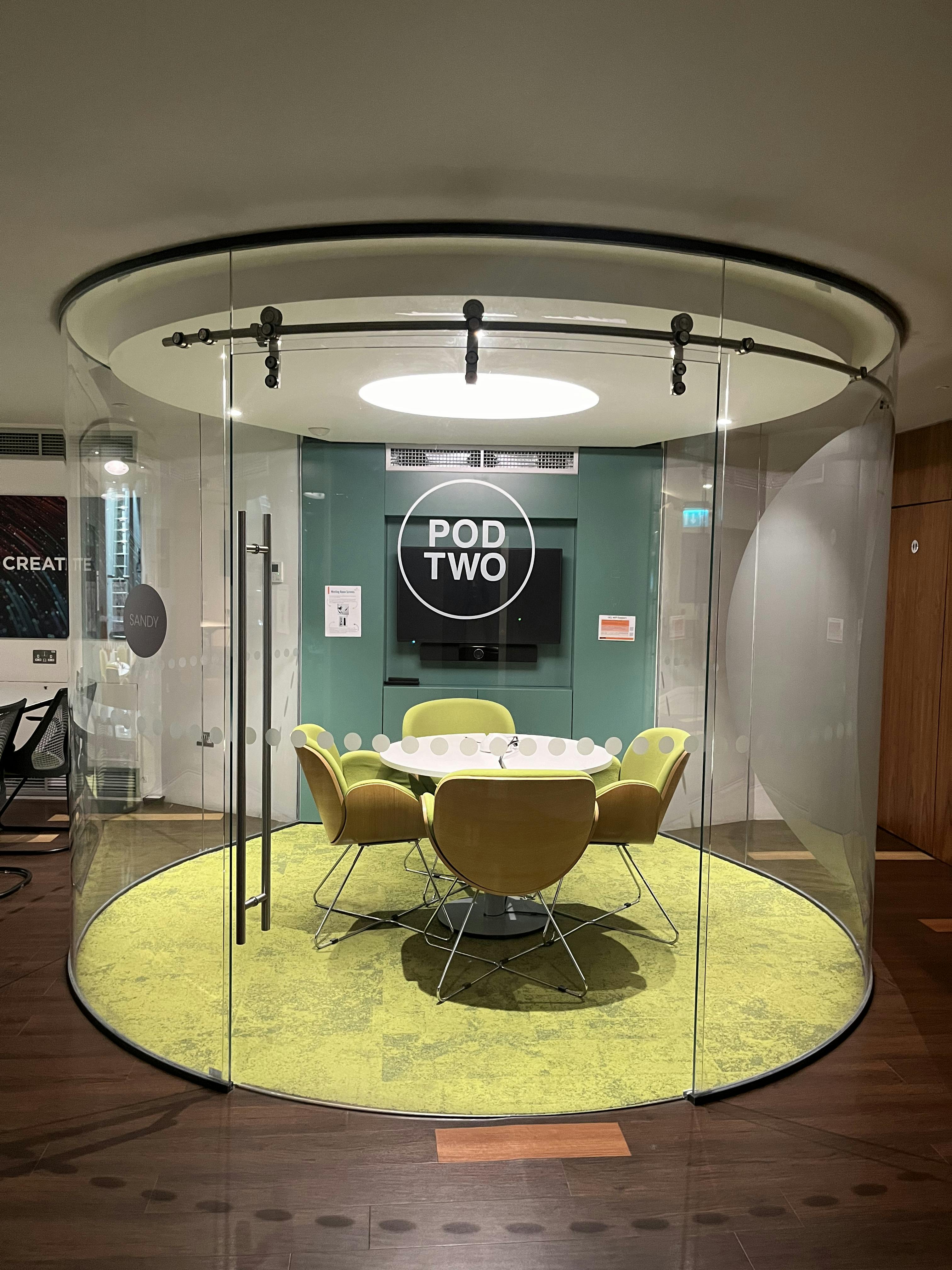 Modern meeting pod with circular table for collaborative brainstorming at IDEALondon.