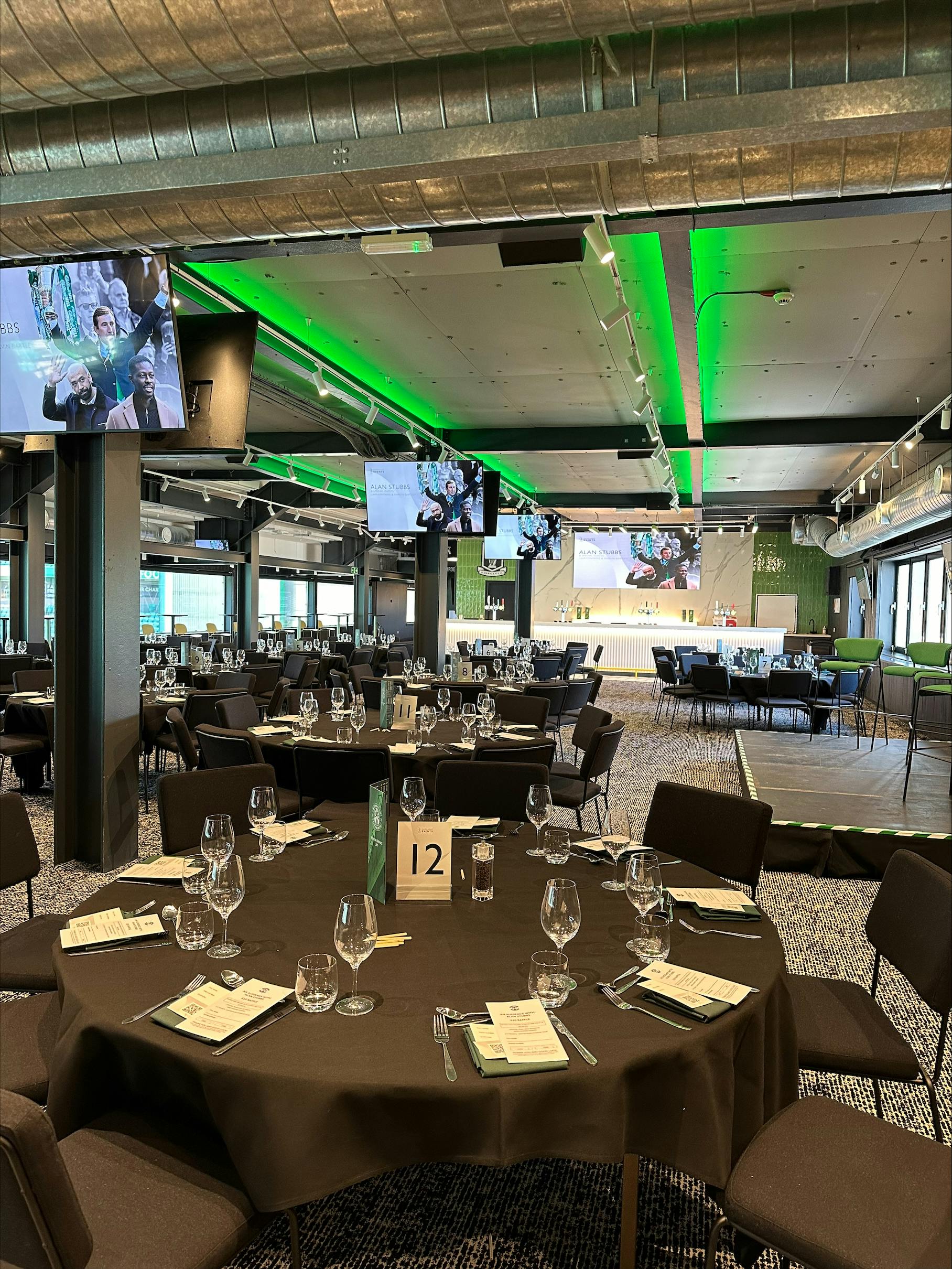 Modern event space at Hibernian FC with elegant tables for formal gatherings.
