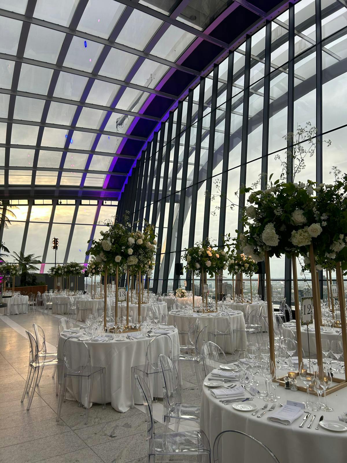 Elegant round tables in City Garden, Sky Garden London, perfect for weddings and corporate events.