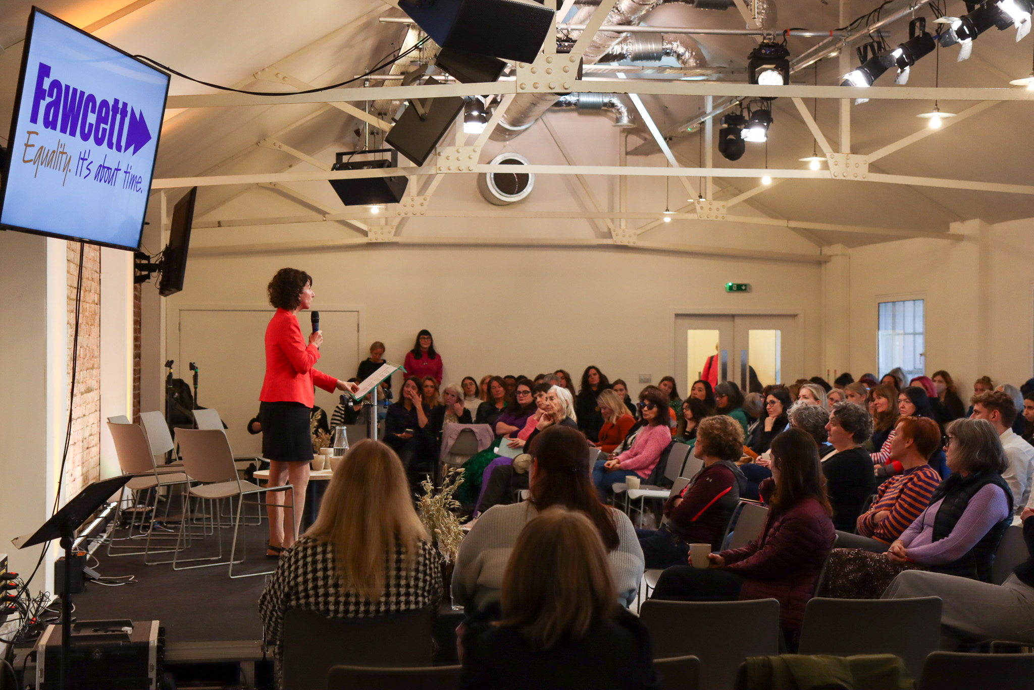 Away Days conference in King's House with speaker engaging audience in modern event space. - Banner