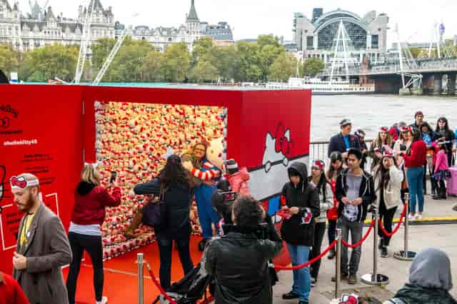 Interactive photo backdrop at Queen's Walk event, promoting engagement and social sharing.