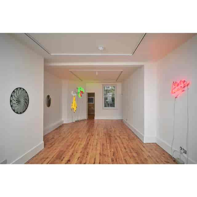 Great Pulteney Street gallery venue with neon lighting for product showcases and art receptions.