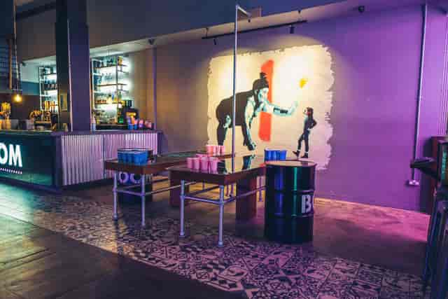 "Vibrant event space with stylish bar and mural for private hire in Birmingham."