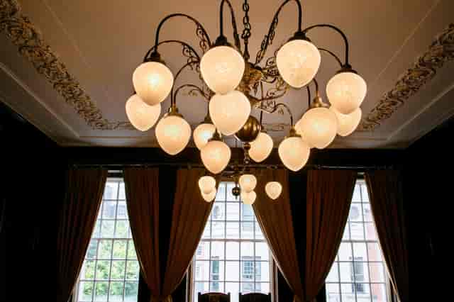 Elegant chandelier in The Drawing Room, Manchester Hall for upscale events and gatherings.