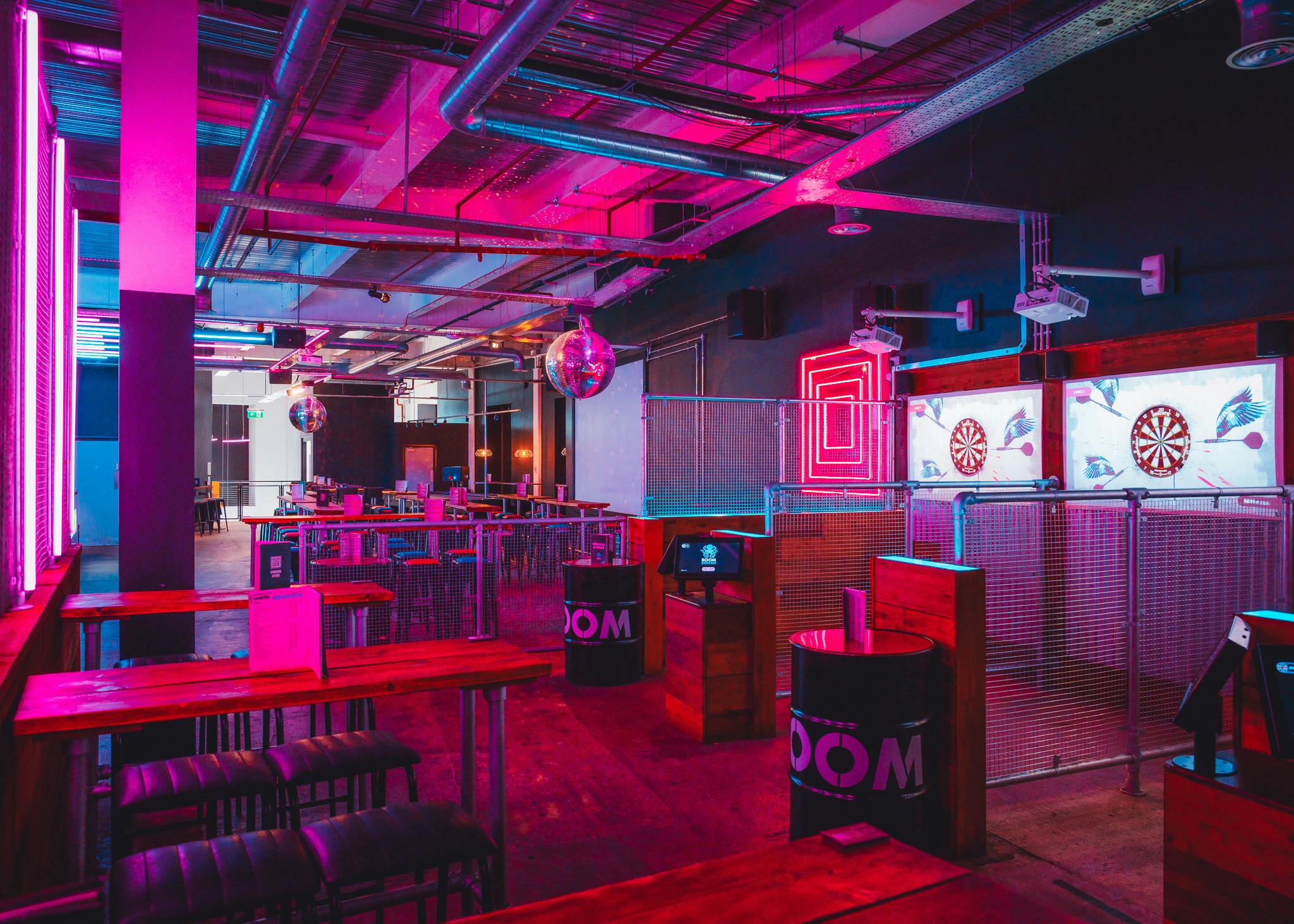 Vibrant event space with neon lights for networking and team-building in Leeds.