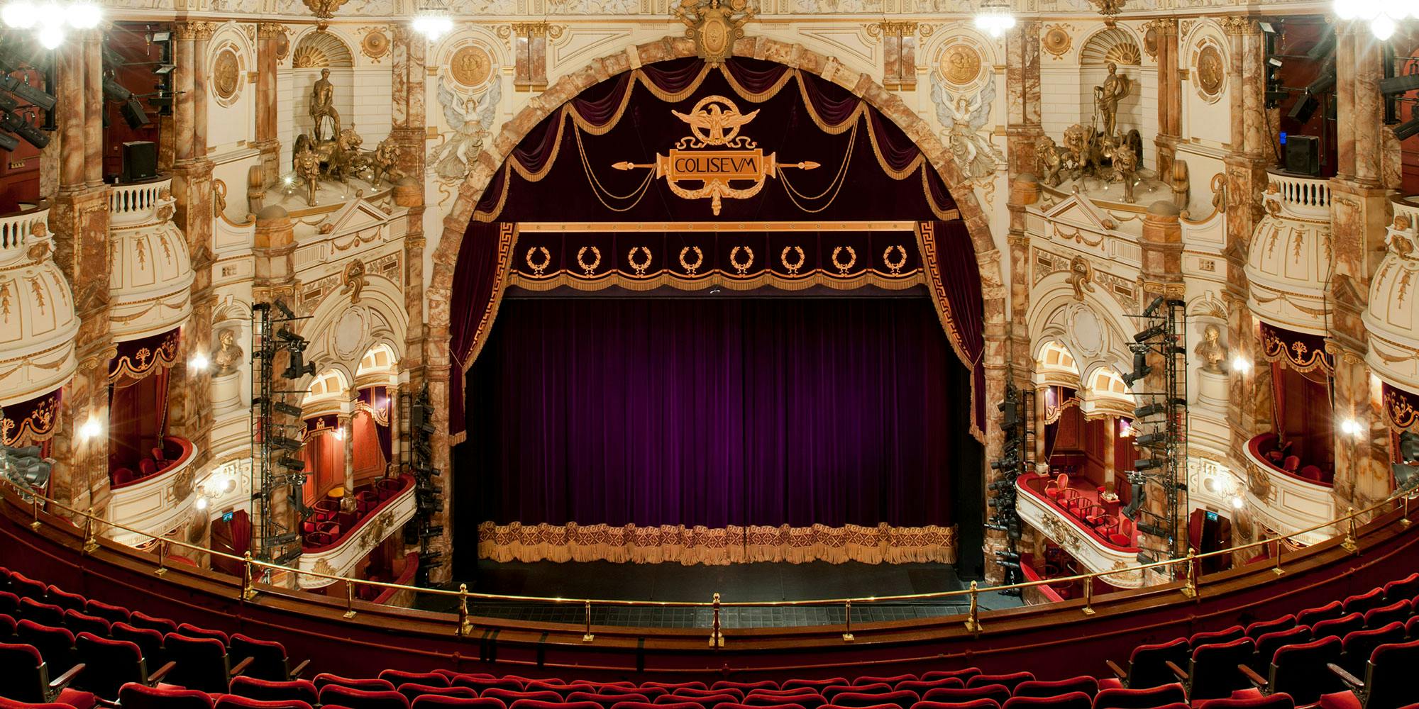 Elegant theater stage with red curtains at London Coliseum, ideal for gala events.