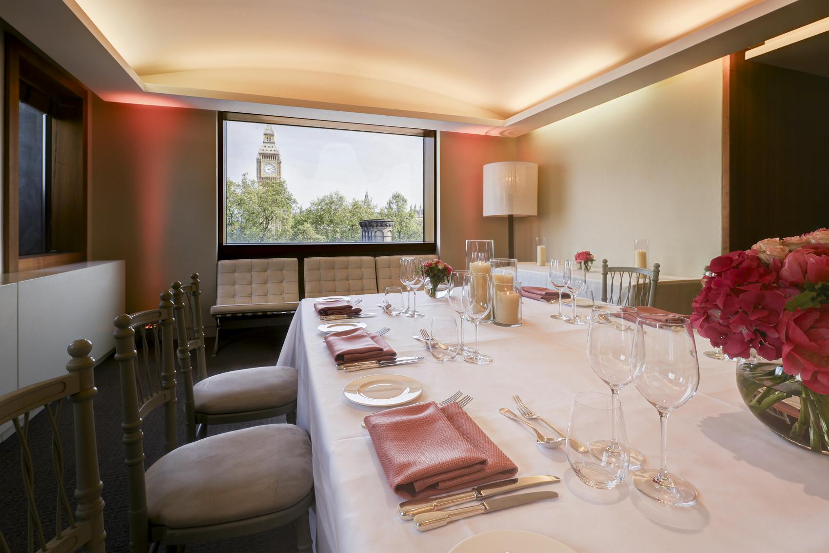 Elegant President's Dining Room set for corporate gatherings with fine china and scenic view.