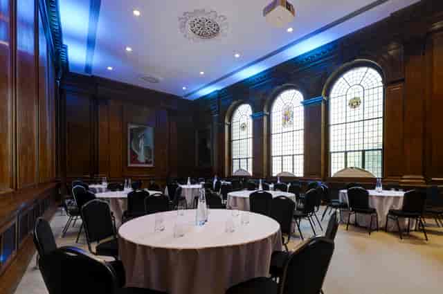 Surveyors House meeting room with wood paneling for corporate events and professional seminars.