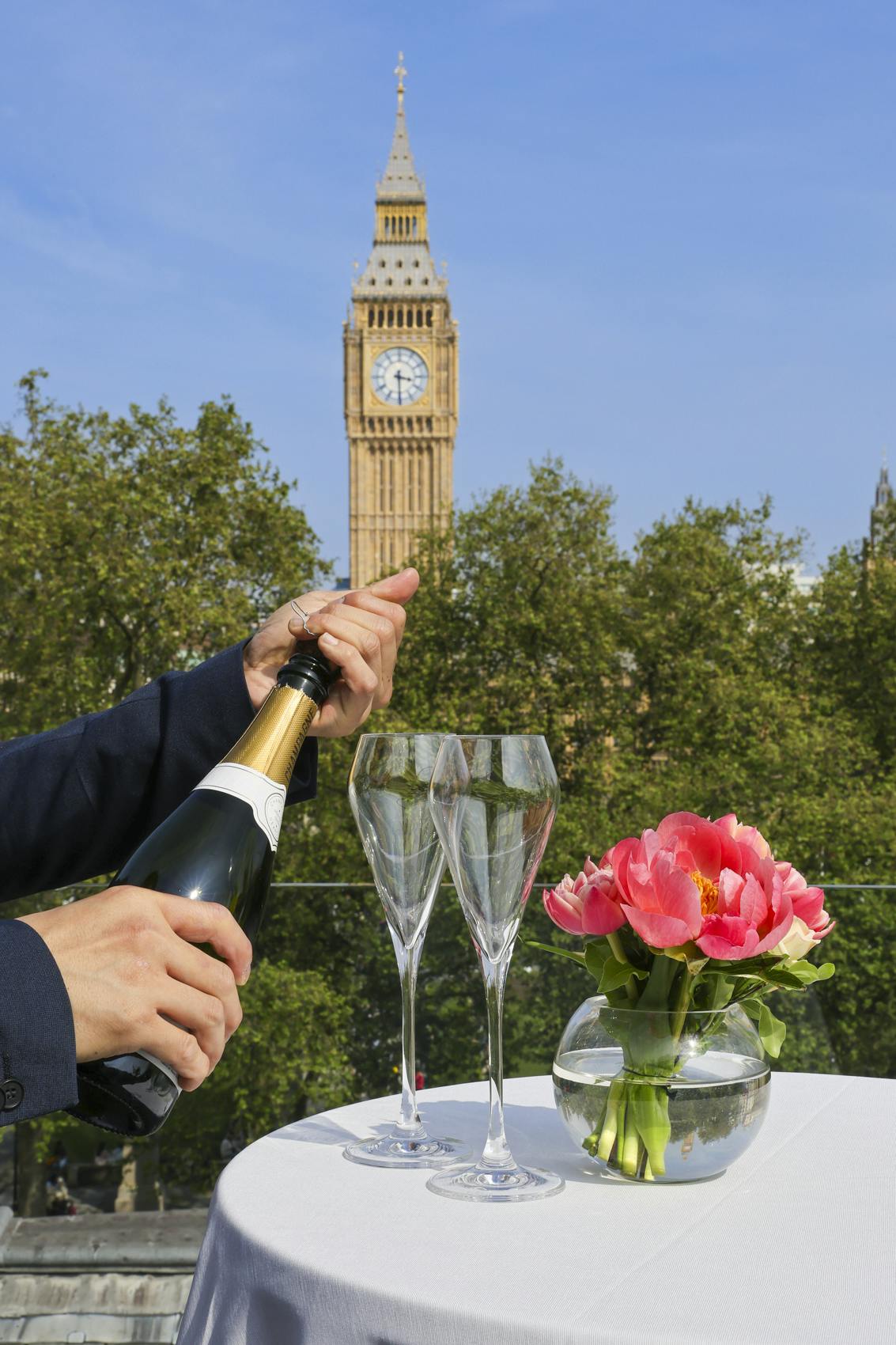 Elegant outdoor event at Terrace, Surveyors House with Big Ben backdrop and champagne toast.