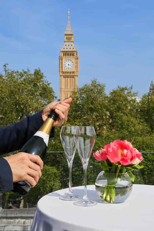 Elegant outdoor event at Terrace, Surveyors House with Big Ben backdrop and champagne toast.