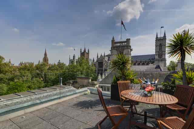 Rooftop terrace with elegant furnishings and iconic architecture, perfect for outdoor events.