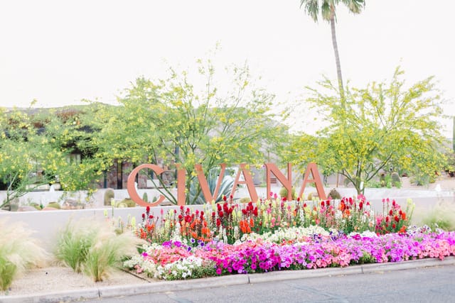 CIVANA Wellness Resort Rose Garden entrance with vibrant flowers, perfect for retreats and events.