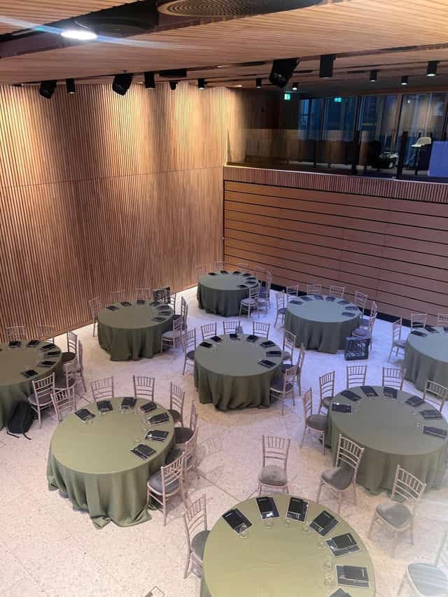 Event space at 8 Bishopsgate with round tables, ideal for conferences and gatherings.