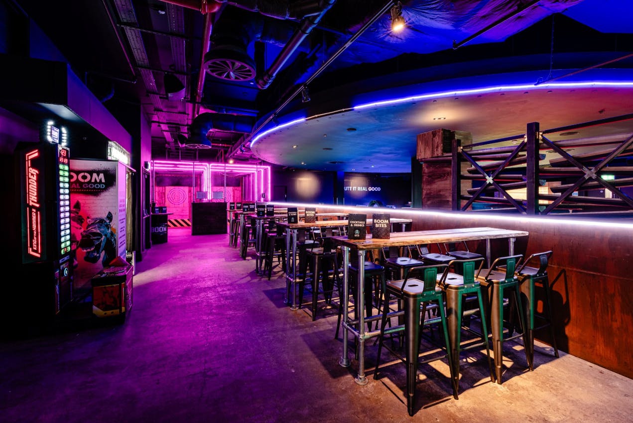 "Vibrant event space with neon lighting for private hire at Boom Battle Bar O2."