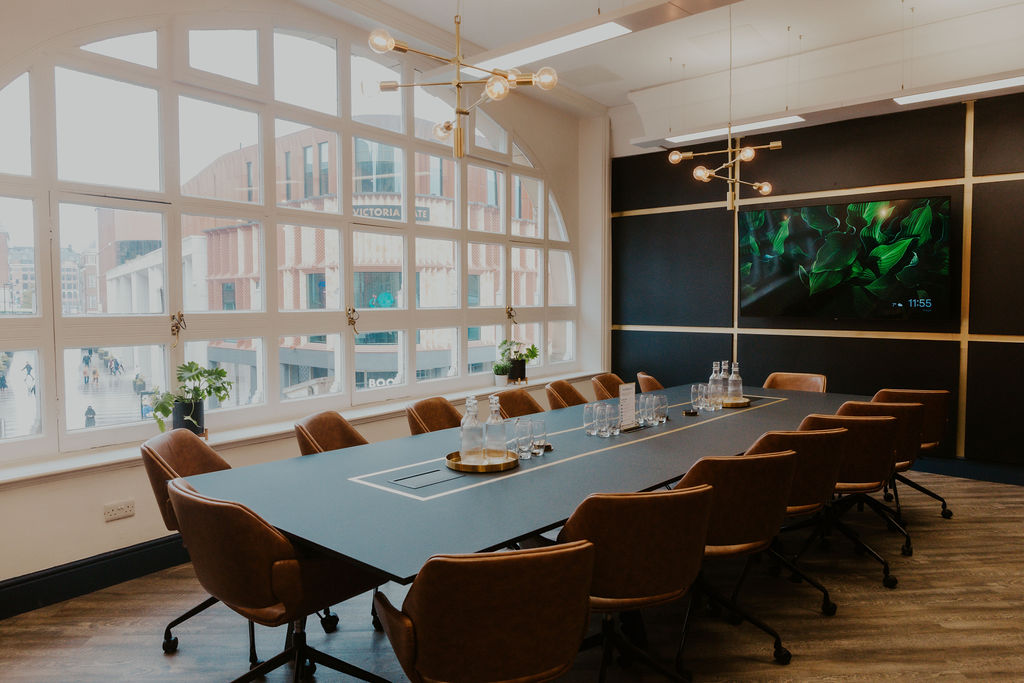 Modern conference room in Wizu Workspace, featuring a sleek table and natural light. - Banner