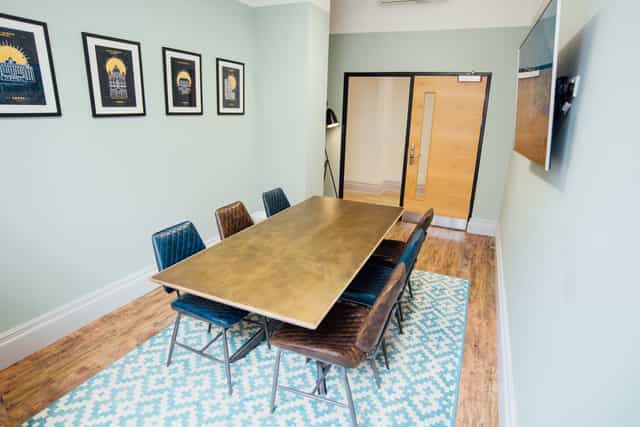Kirkgate Suite meeting room with sleek table, ideal for brainstorming and presentations.
