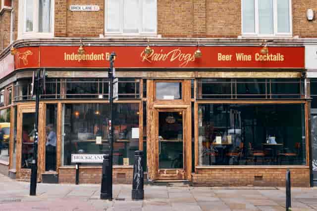 Rain Dogs Bar corner storefront, ideal venue for casual networking and corporate mixer events.