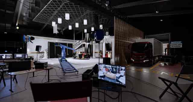 Hybrid event space in London with professional lighting and spacious stage area.