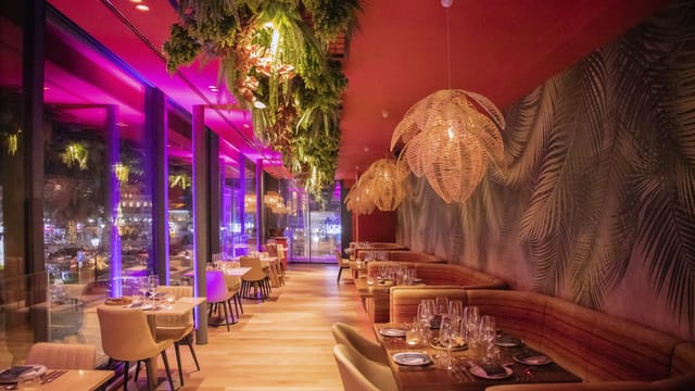 Vibrant restaurant interior with modern decor, perfect for upscale events and gatherings.