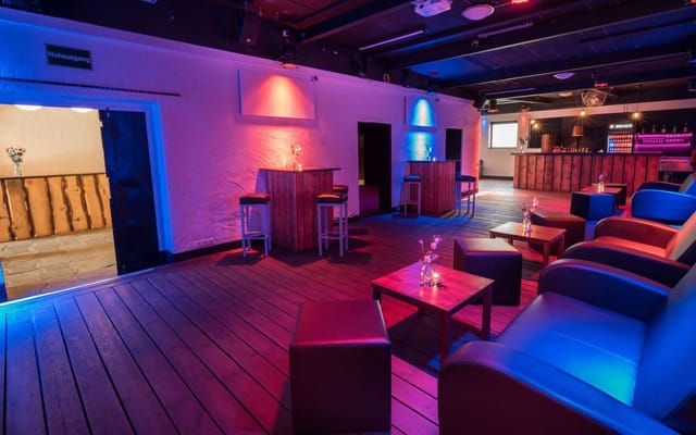 Versatile event space in James June with ambient lighting for gatherings and receptions.