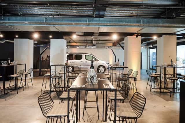 Modern event space with sleek furniture for networking and product launch.