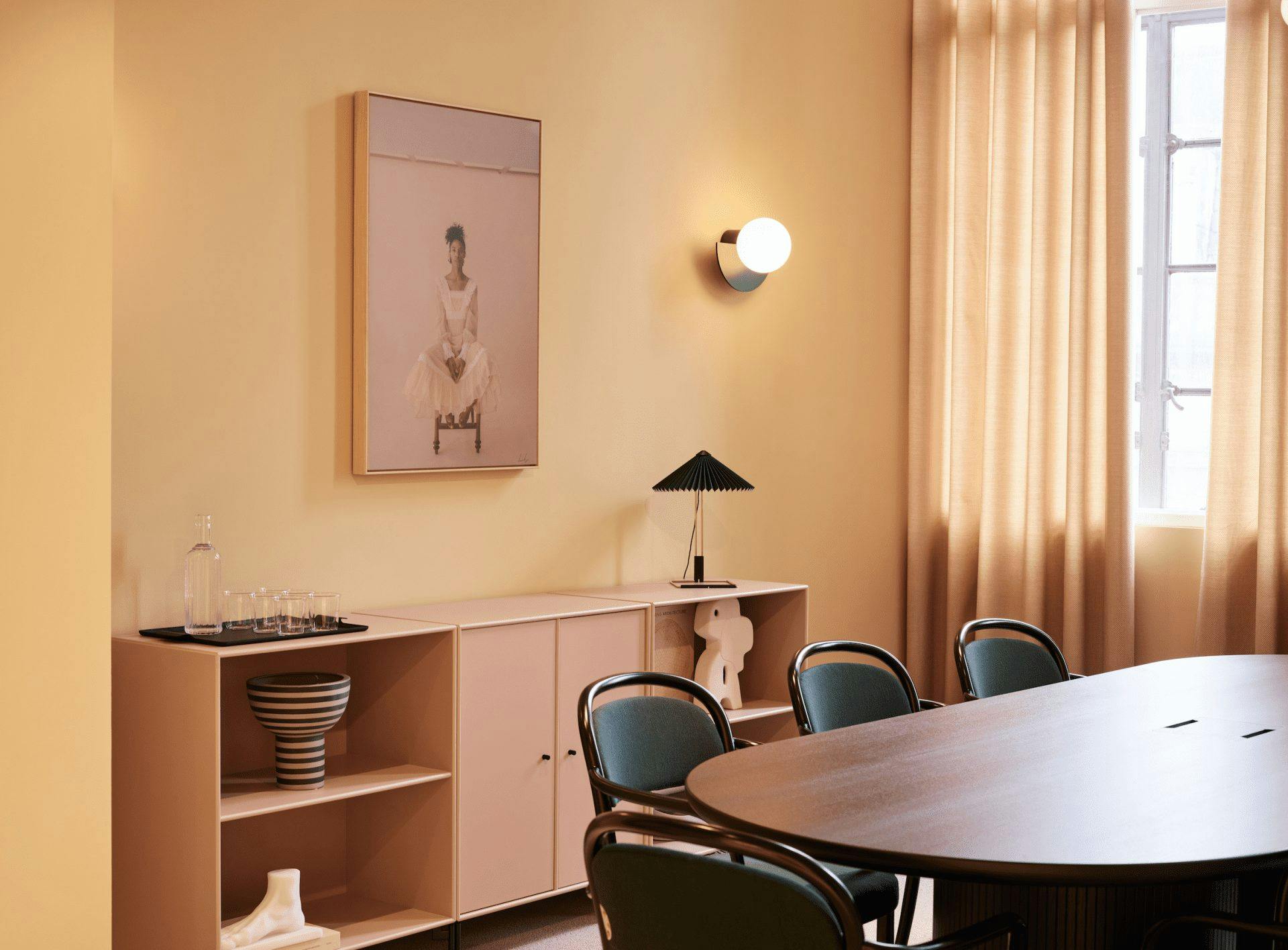 Modern dining room with spacious table for collaborative meetings and events.