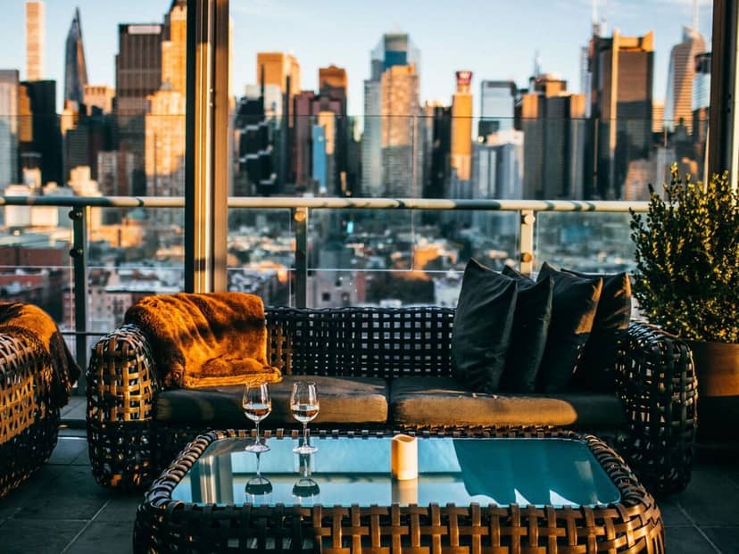 Stylish rooftop lounge with city skyline, ideal for upscale events and cocktail receptions.