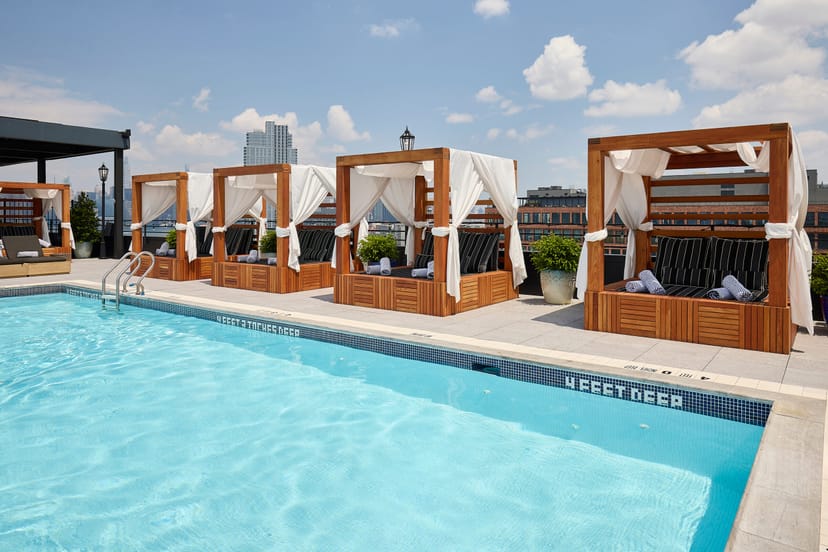Rooftop pool and lounge in Arlo Williamsburg, ideal for upscale summer events.